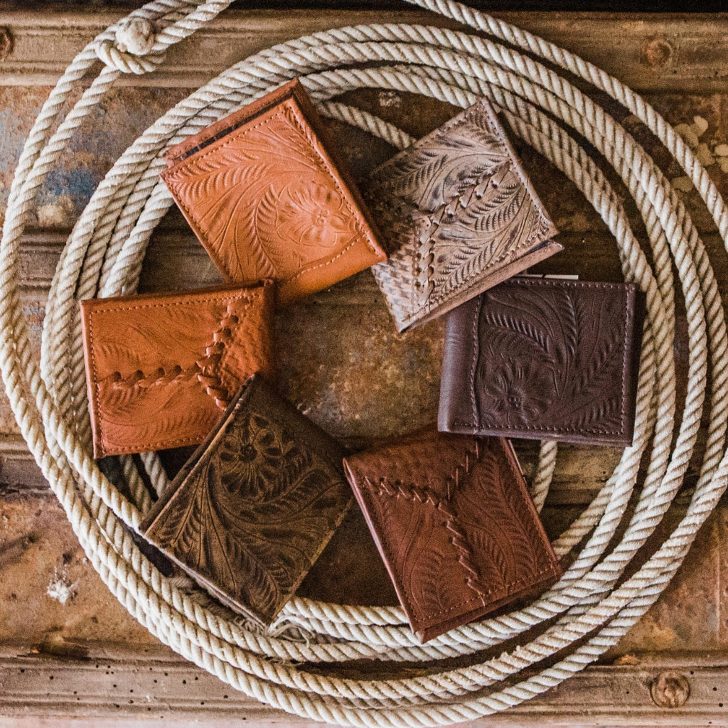 American West men’s leather wallets collection featuring handcrafted western wallets with floral tooled leather and artisan craftsmanship