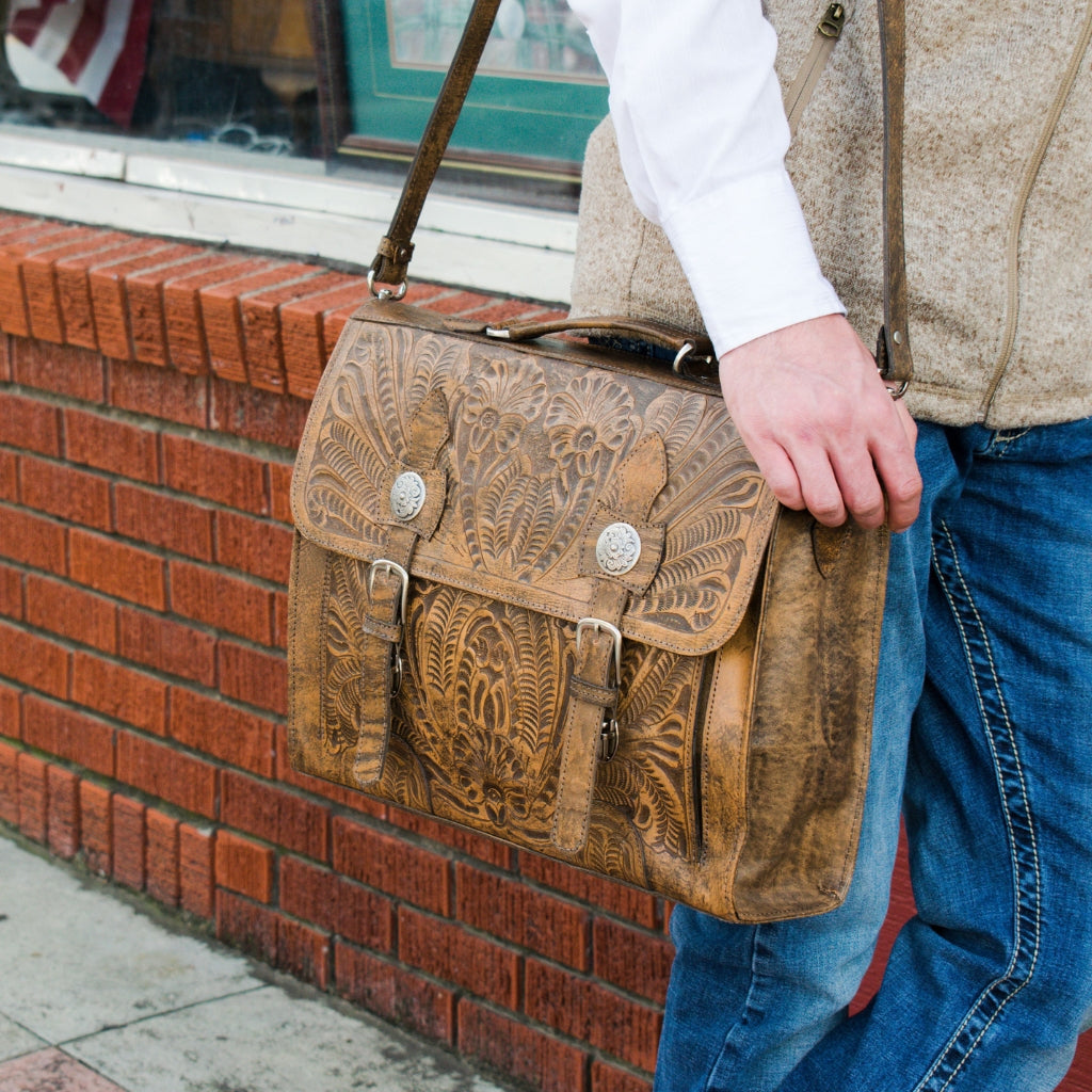 American West leather briefcase featuring floral tooled leather design, handcrafted western detailing, and vintage messenger bag styling
