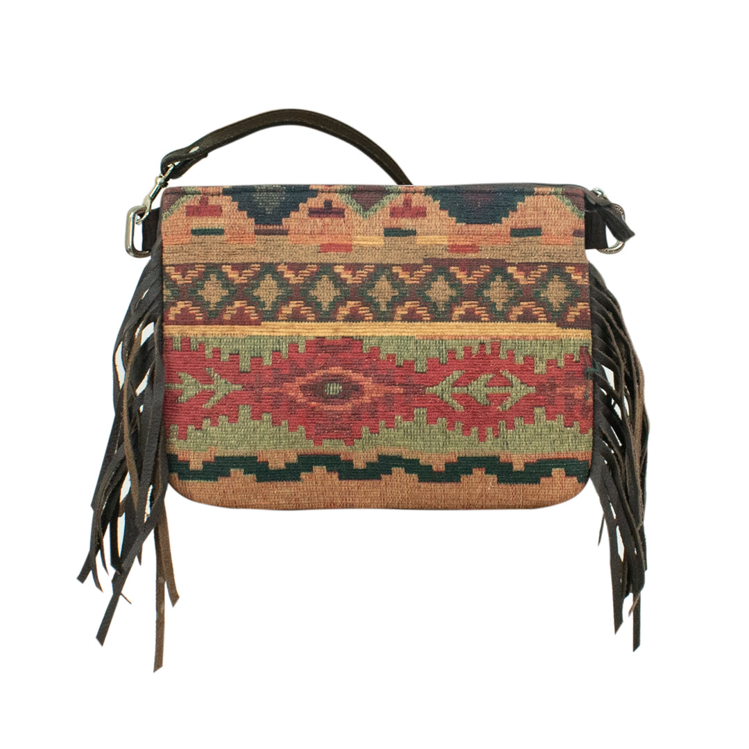 Handbag with tribal pattern and fringes on a white background