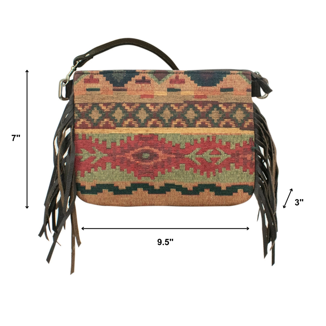 Handbag with tribal pattern and fringes on a white background with dimensions