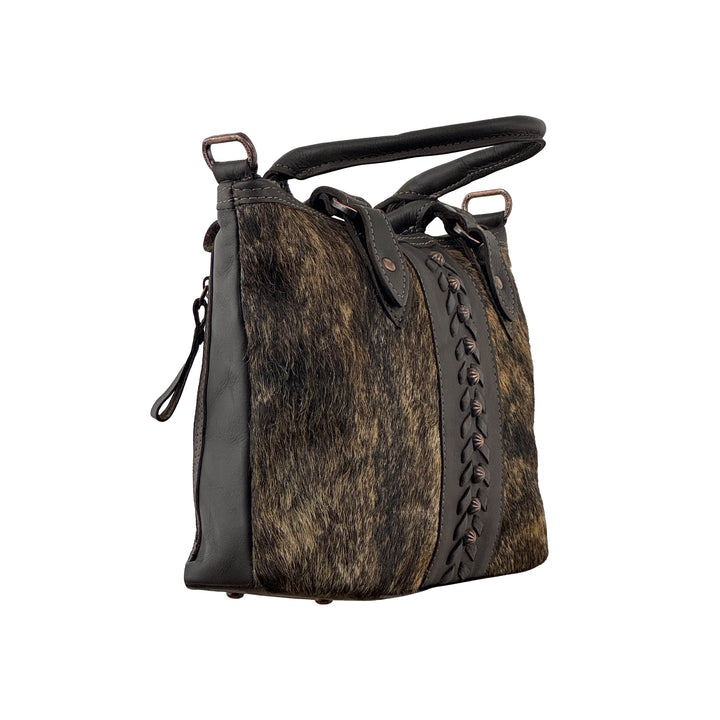 Side view of Cow Town conceal carry convertible satchel in brindle with hair-on hide leather accents