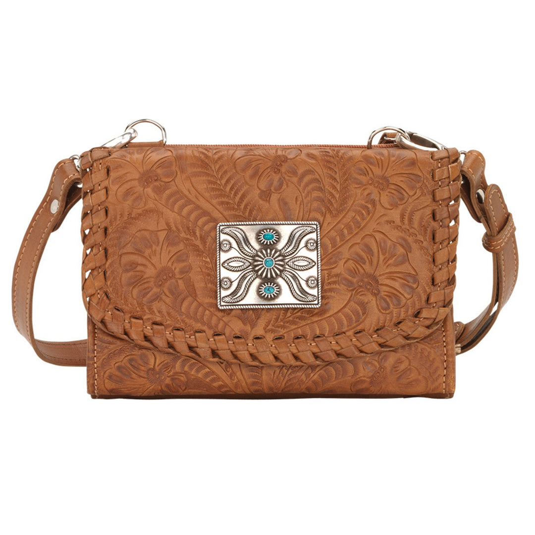 Mohave Canyon crossbody bag in natural tan with hand tooled leather pattern and concho