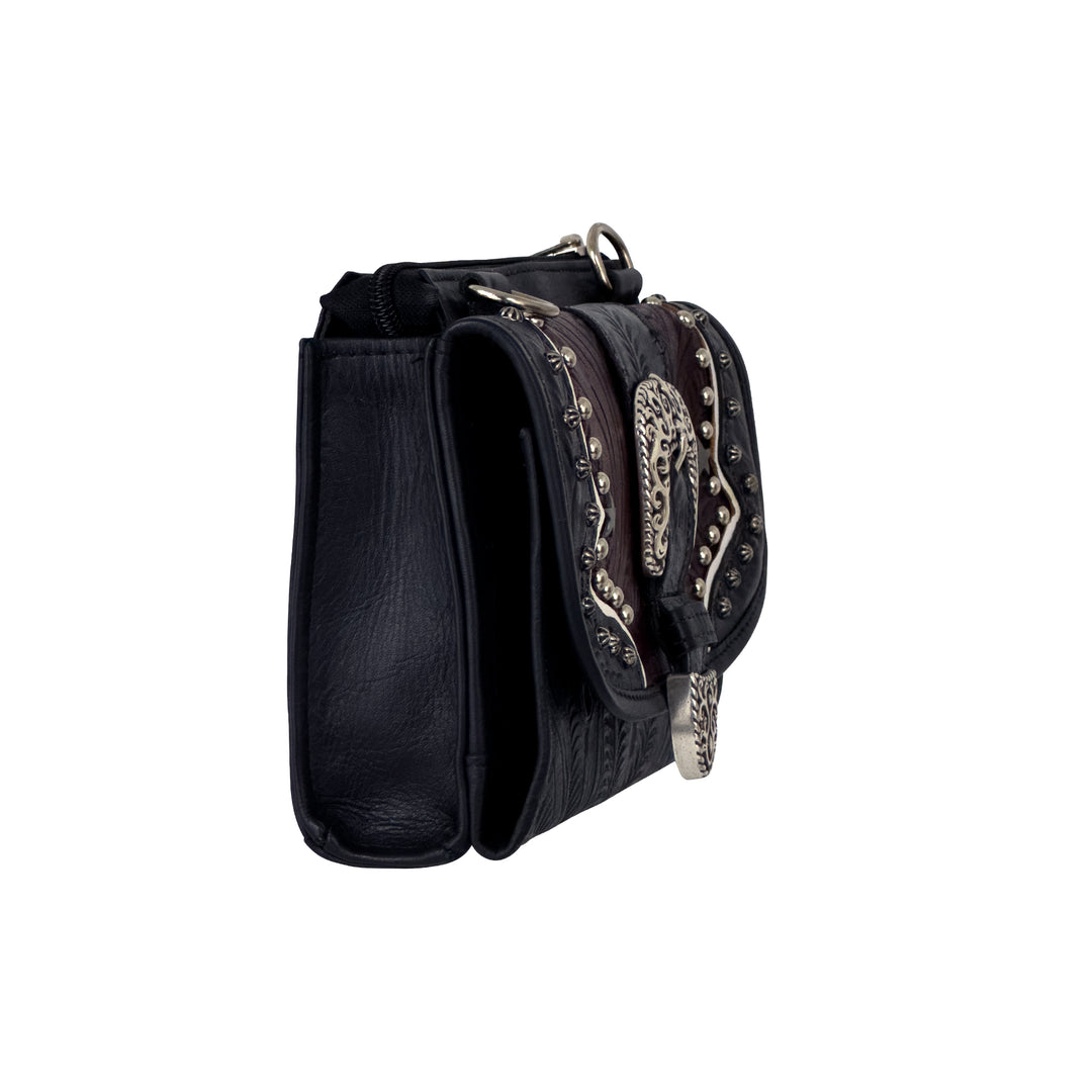 Side view of Texas Two Step crossbody bag in navy blue with hand tooled leather and buckle accents