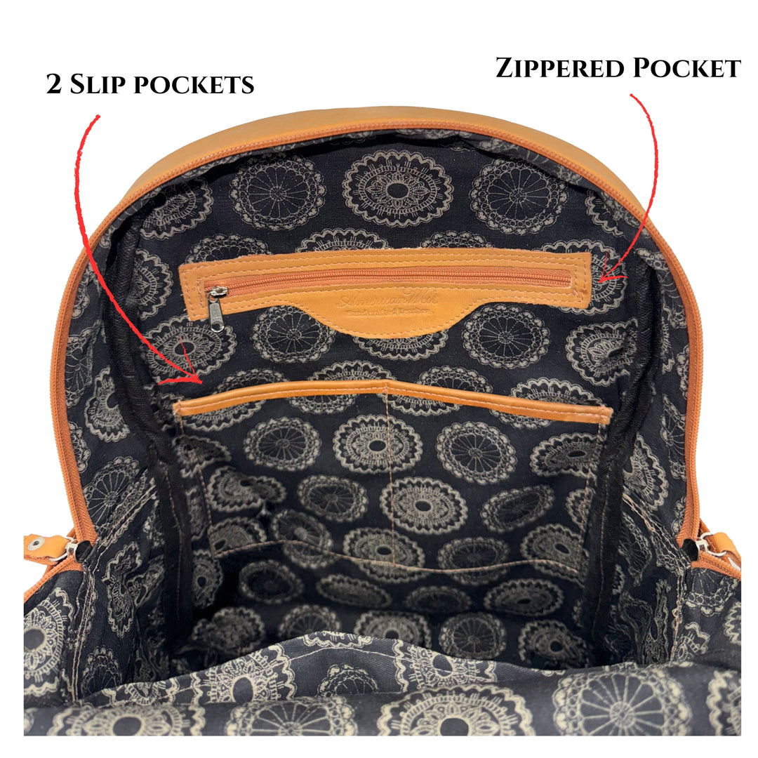 Inside view of Classic Travel backpack in natural tan showing zippered and slip pockets