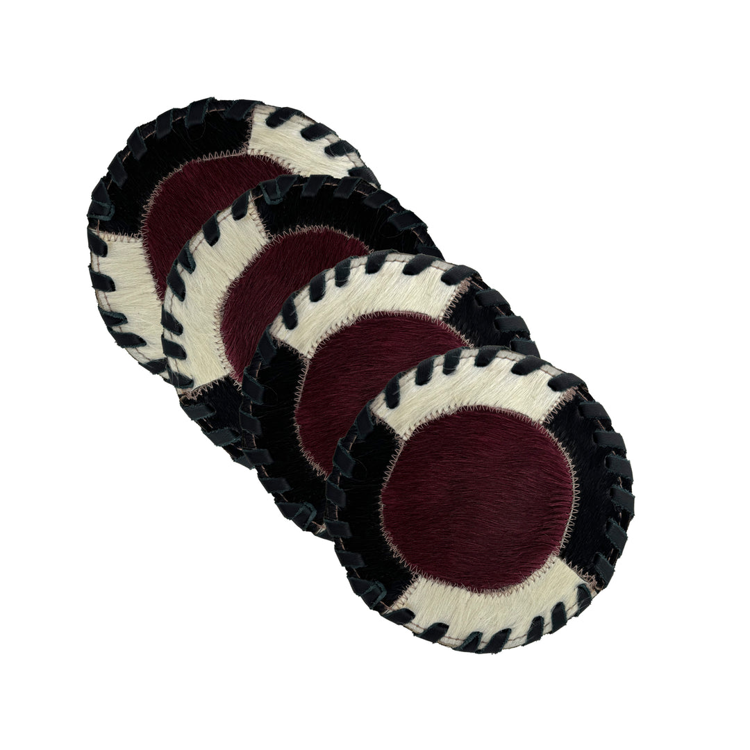 American West at Home coaster with crimson hair-on hide center and hand tooled leather trim shown in four pack