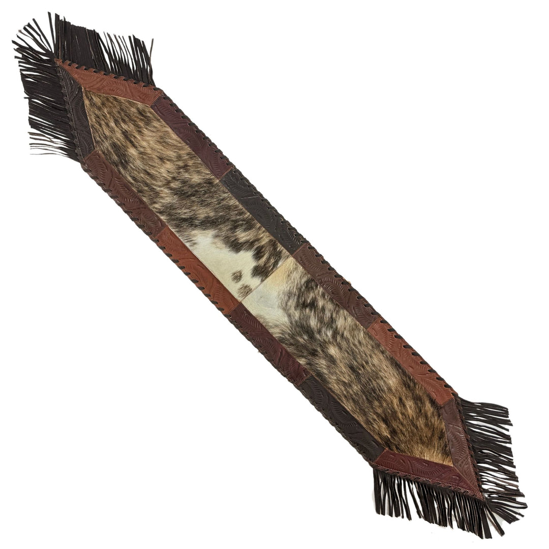 American West at Home sixty four inch hair-on hide table runner in brindle hair-on with hand tooled leather and fringe accents