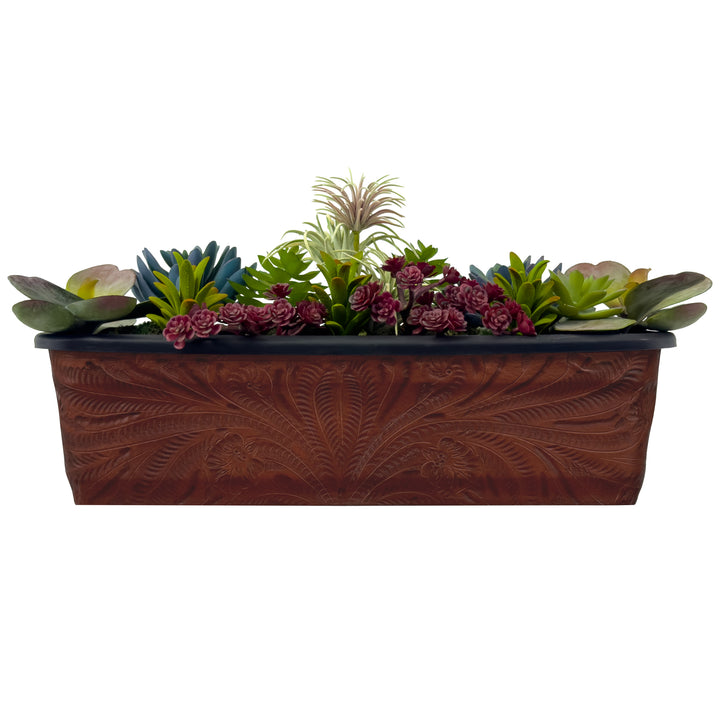 American West at Home eighteen inch rectangle planter in medium brown with hand tooled leather accents shown with flowers