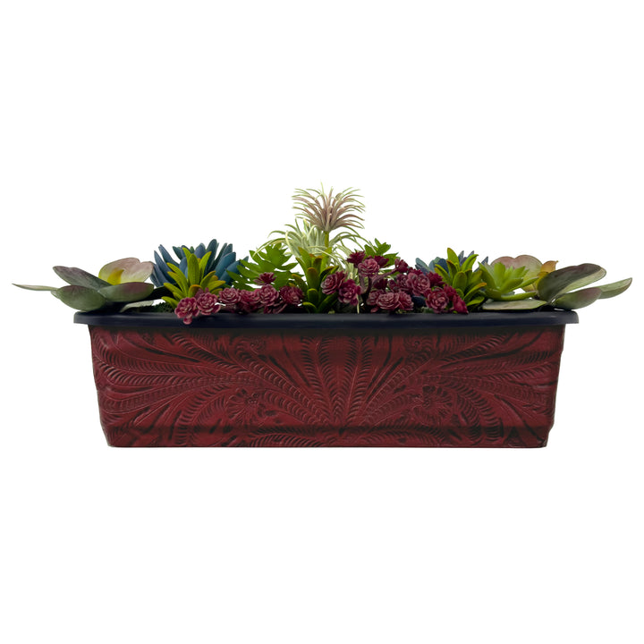 American West at Home rectangle planter in crimson with hand tooled leather accents shown with flowers