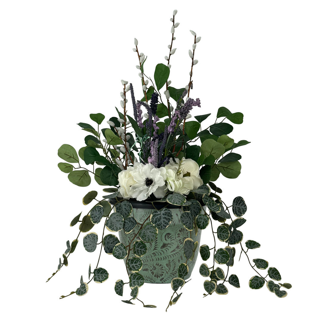 American West at Home ten inch round planter in crimson with hand tooled leather accents shown with flowers