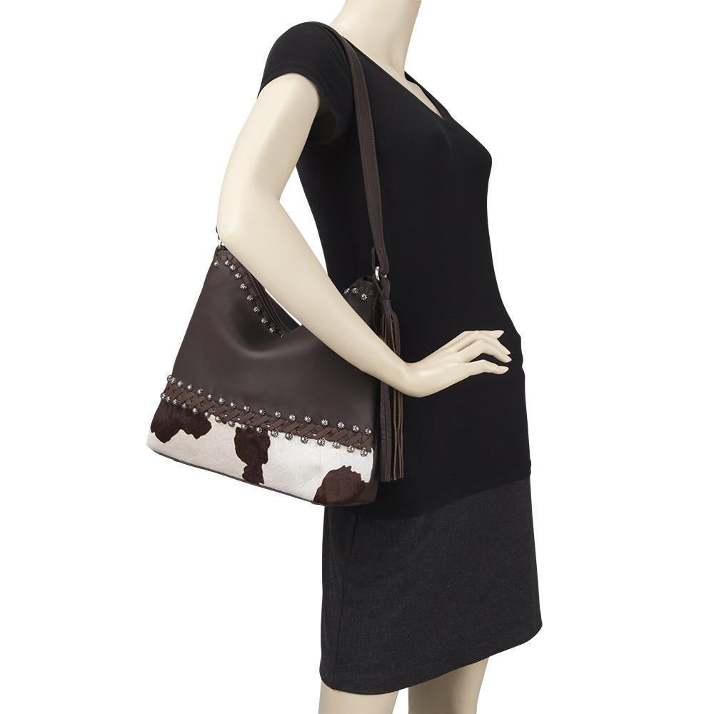 Wild Horses shoulder bag in pony hair-on with hand tooled leather accents on mannequin