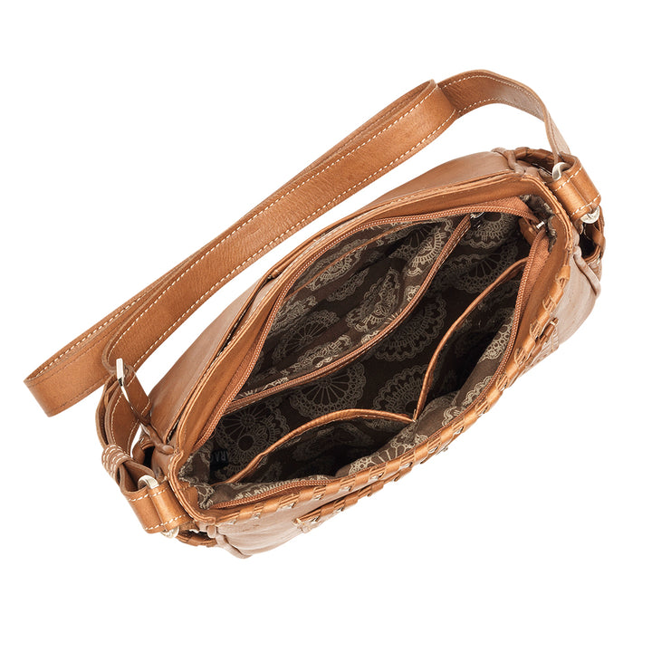 Inside view of Gypsy Patch crossbody bag with one zippered and two slip pockets