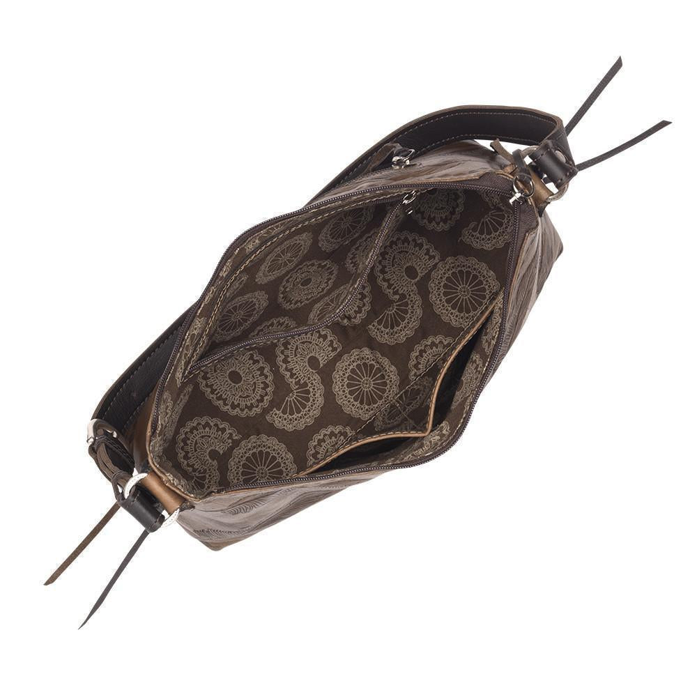 Inside view of Sacred Bird shoulder bag with one zippered and two slip pockets