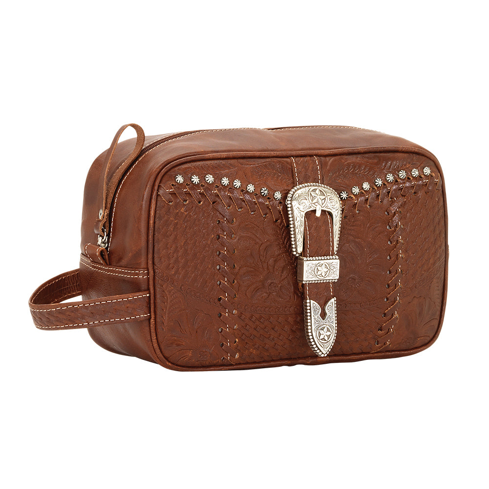 Side view of Classic Travel dopp/shaving kit in medium brown with hand tooled leather and buckle set accents