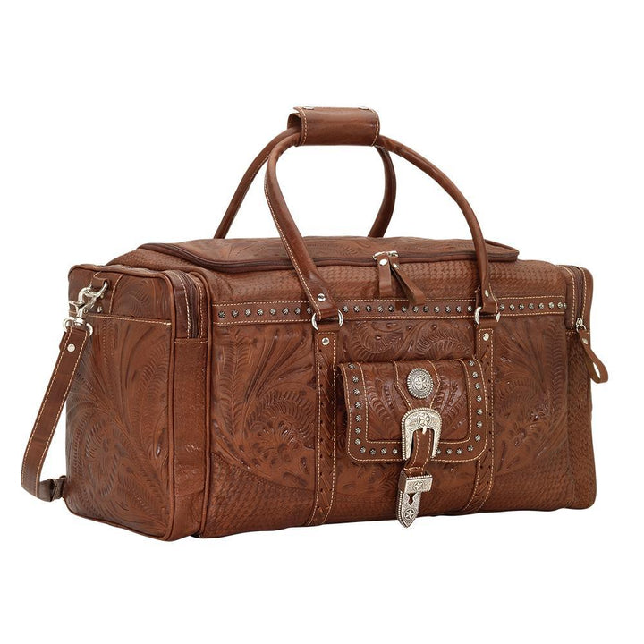 Side view of Classic Travel duffel bag with front pouch and side zipper pockets in medium brown with hand tooled leather and buckle set accents