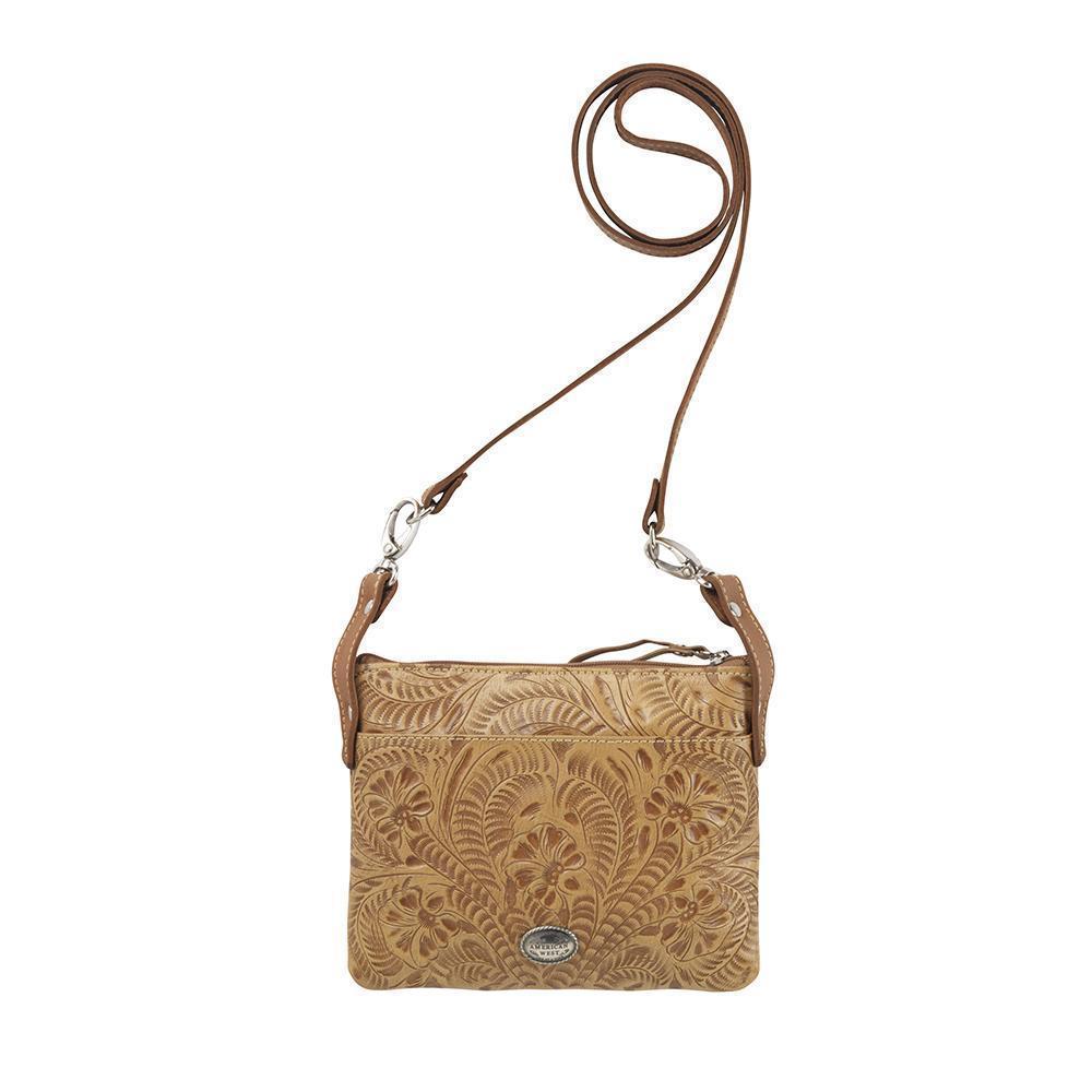 Back view of Turquoise Mesa crossbody bag/hip bag with slip pocket and hand tooled leather pattern