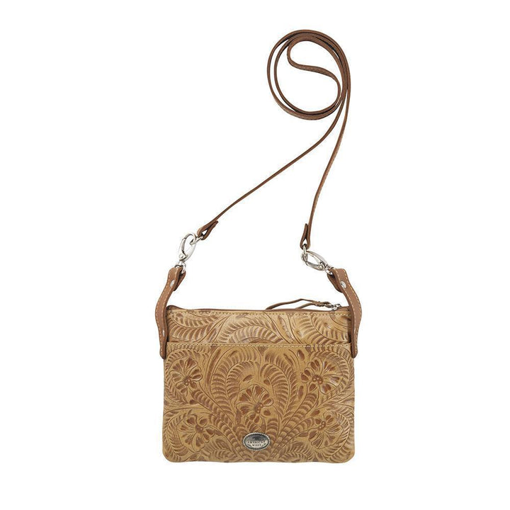 Back view of Turquoise Mesa crossbody bag/hip bag with slip pocket and hand tooled leather pattern