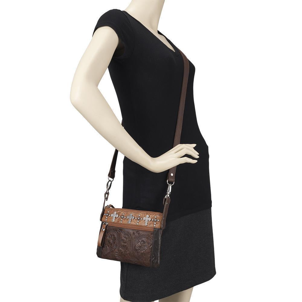 Frontier Cross crossbody/hip bag in dark brown with hand tooled leather accents on mannequin