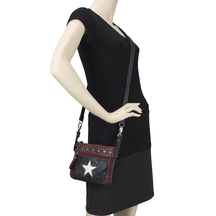 Lone Star crossbody/hip bag in navy blue with hand tooled leather accents on mannequin