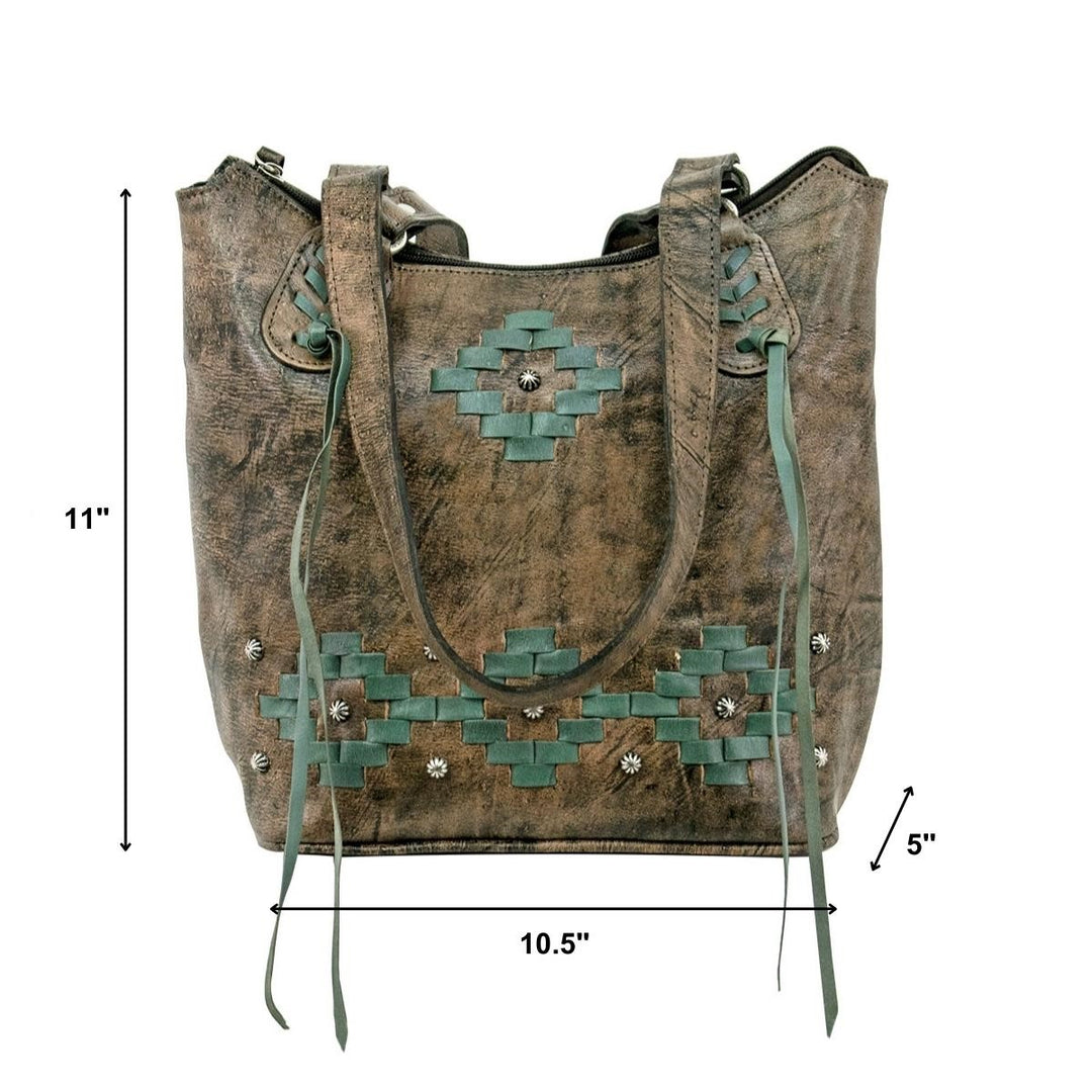 Lifestyle with model of Tribal Weave bucket tote in distressed charcoal brown with leather stitching accents
