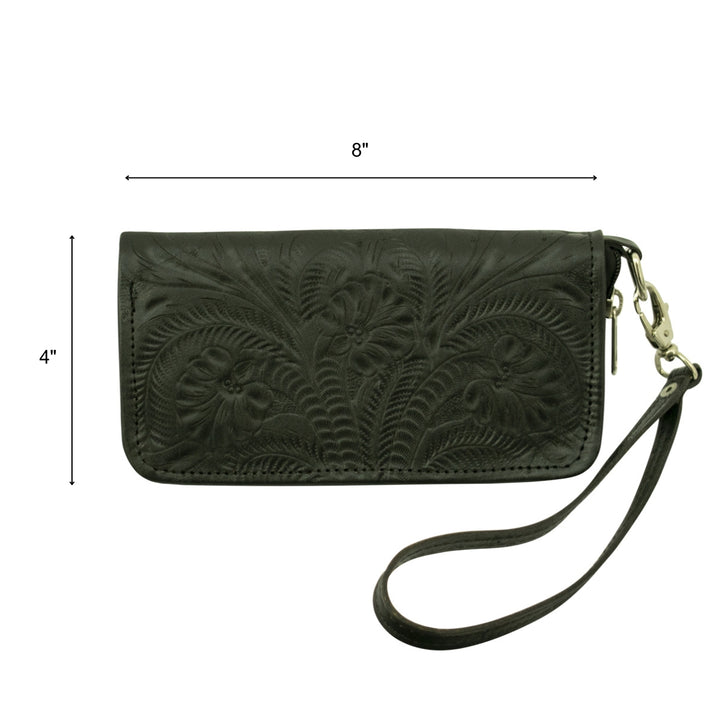Lifestyle with model of Ladies zip-around wallet in chocolate brown with hand tooled leather accents