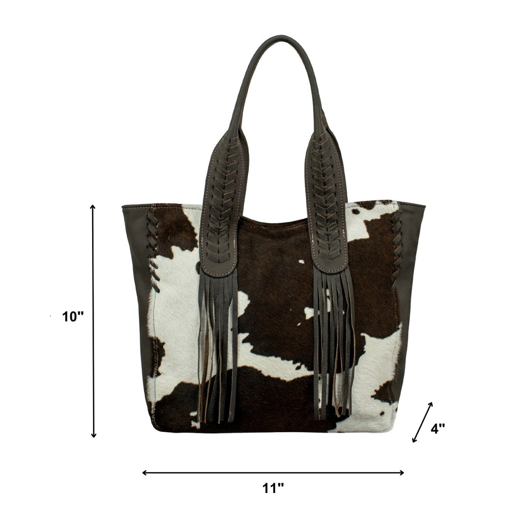 Lifestyle with model of Cowtown tote in pony with hair-on hide leather accents