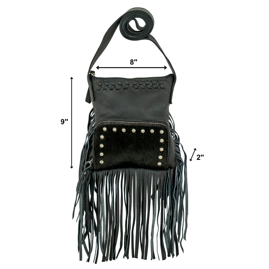 Lifestyle with model of Fringed Cowgirl crossbody in black with hair-on hide leather and fringe accents